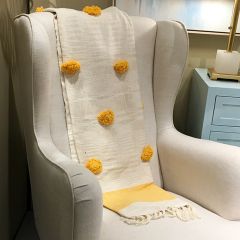 Woven Throw With Pom Pom Accents