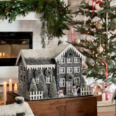 Lighted Snow Covered Farmhouse