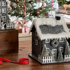 Lighted Snow Covered Village House
