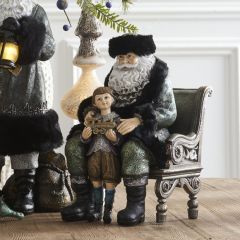 Sitting Santa and Child Figurine