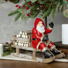 Sledding Santa Figurine Red