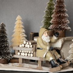 Sledding Santa Figurine Tan