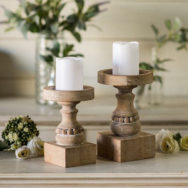 https://www.antiquefarmhouse.com/media/catalog/product/cache/87f7a85cd0f3ed2c3dff34ce326cd3a5/b/e/beaded-chunky-wood-candle-holder-set-of-2_1_1_1.jpg