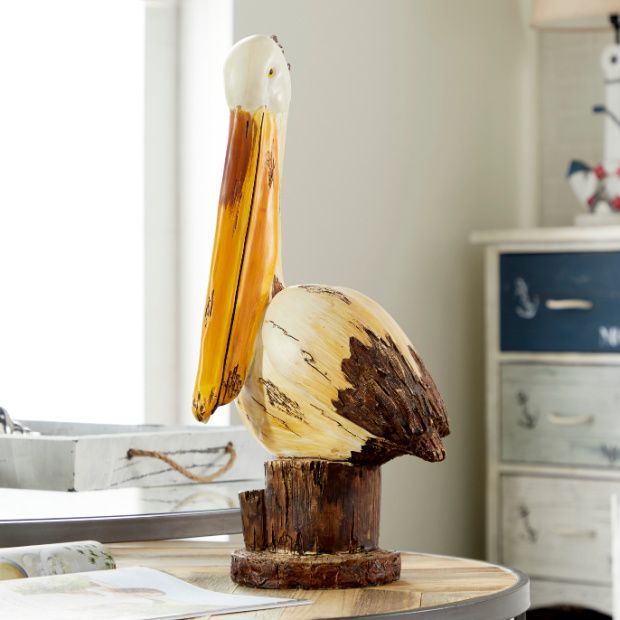 https://www.antiquefarmhouse.com/media/catalog/product/cache/87f7a85cd0f3ed2c3dff34ce326cd3a5/r/u/rustic-pelican-sculpture_1.jpg