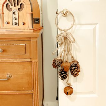 Rustic Jingle Bells And Pinecone Door Hanger