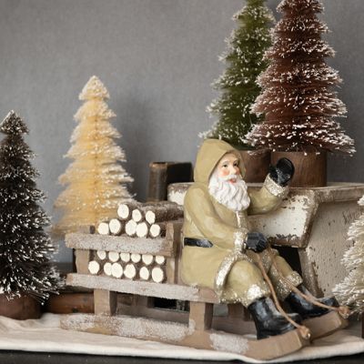 Sledding Santa Figurine Tan