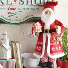 Santa Statue With Gingerbread House