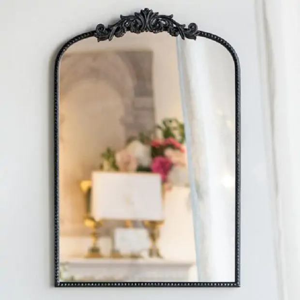 Elegant Black Mirror With Ornate Detail