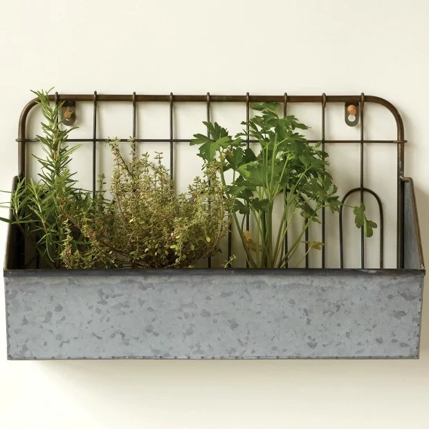 Metal handing planter with rustic fenced backboard